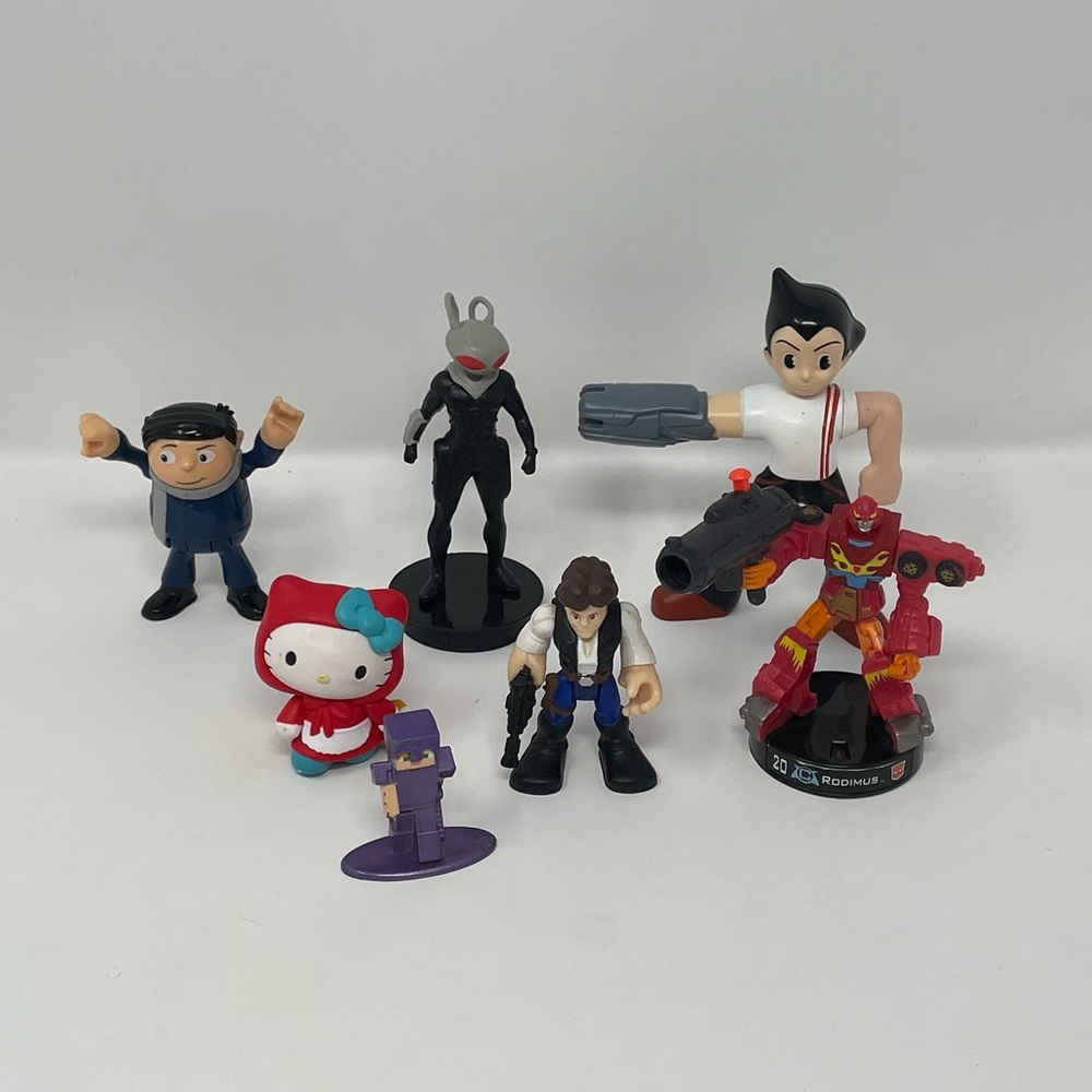 Mixed Lot 7 Action Figures Astro Boy Hello Kitty Star Wars Transformers Minions
